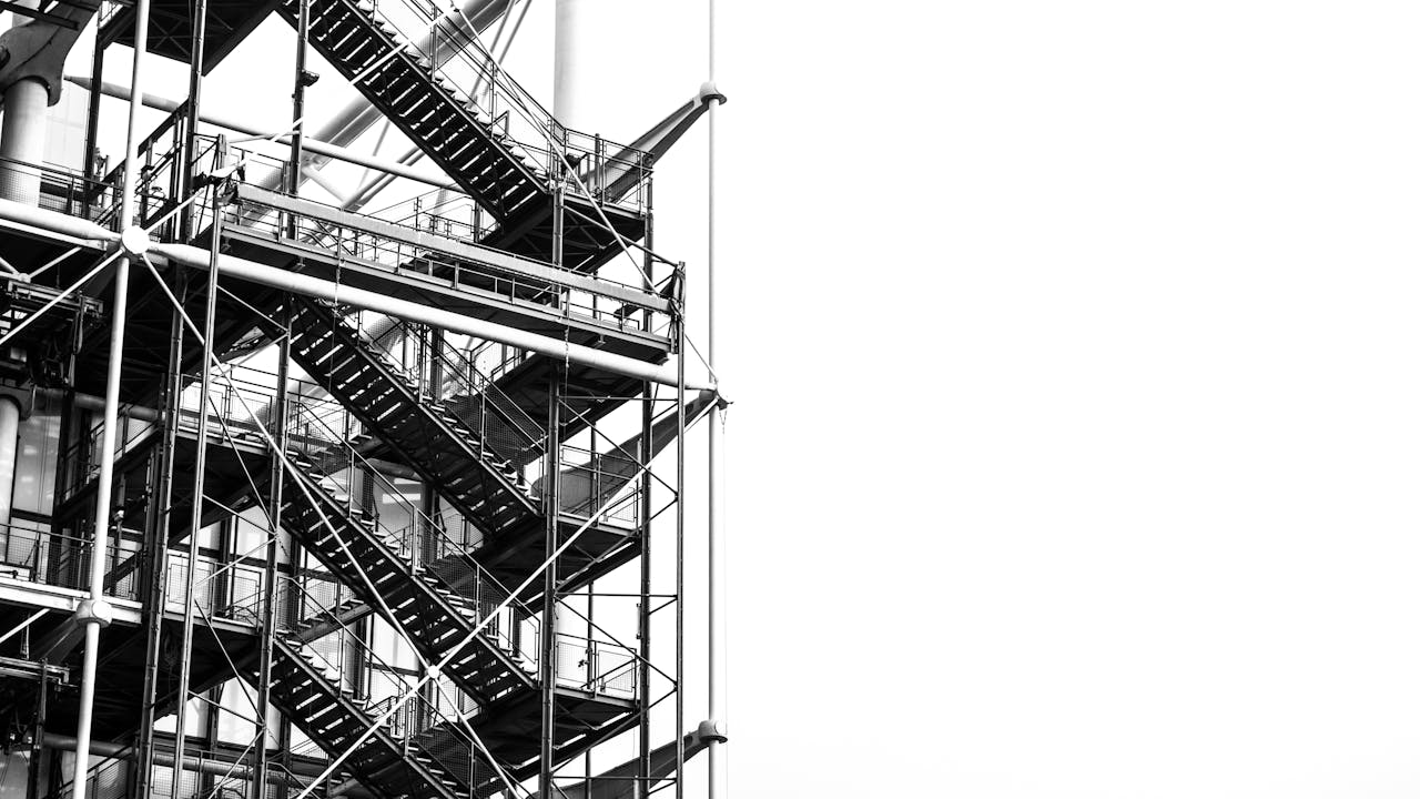A striking black and white image of industrial stairs at Pompidou Center, Paris.